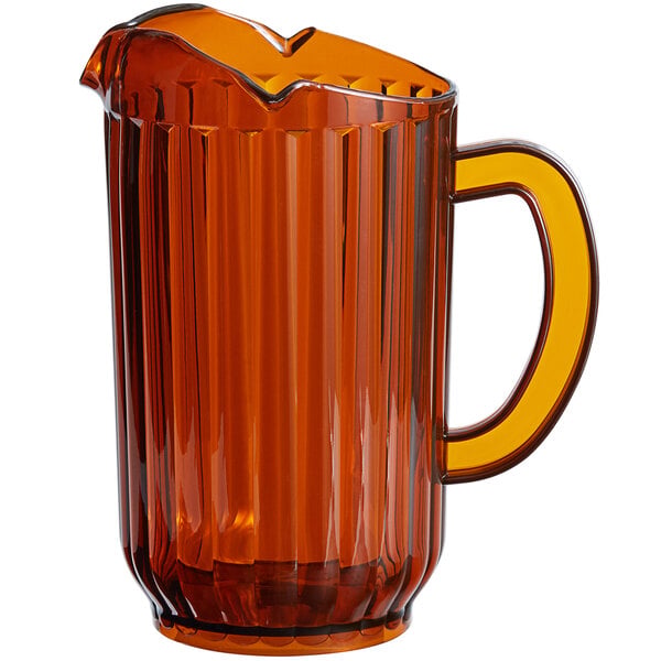 A large amber-colored plastic beverage pitcher with a handle and three spouts.
