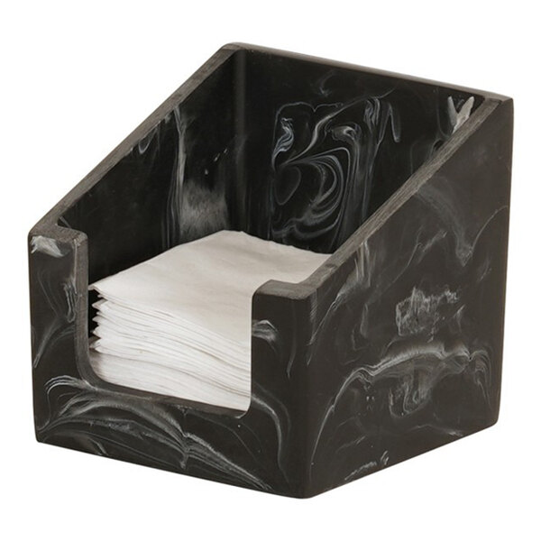 A black swirl square resin napkin holder containing white napkins.