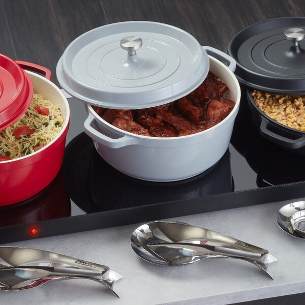 A rectangular titanium stainless steel warming shelf with three round pots containing different foods placed on top.