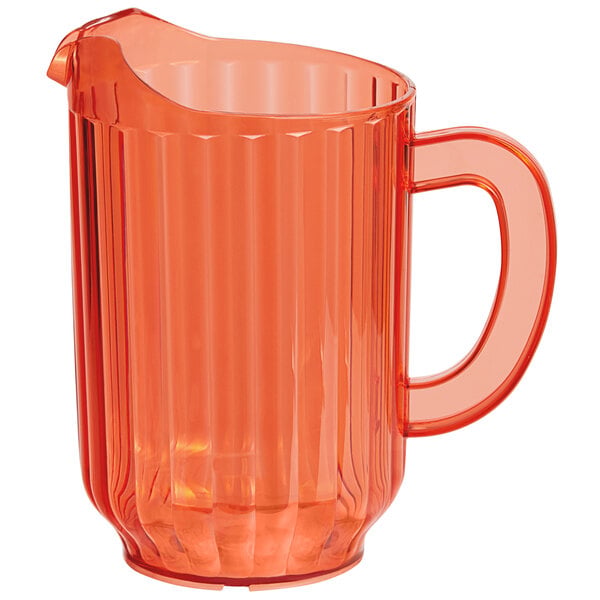 A coral-colored plastic beverage pitcher with a handle and spout.