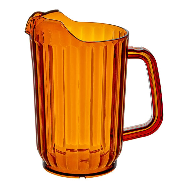 A 32 oz. amber-colored plastic beverage pitcher with a handle and spout.