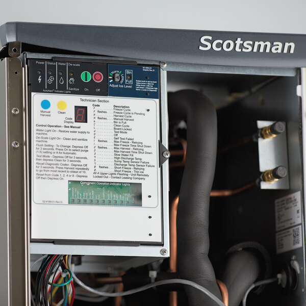 A Scotsman Prodigy Elite Series air-cooled medium cube ice machine with dispenser and Vari-Smart ice level control kit.