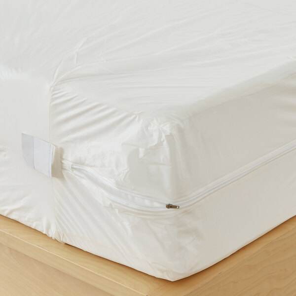 A white vinyl waterproof mattress protector with a zipper, designed for a hospital twin XL mattress.