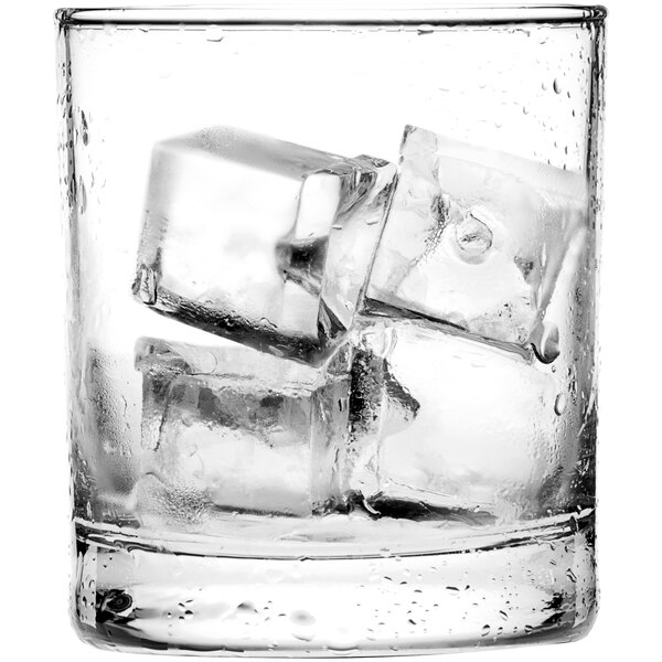 A clear glass filled with several medium-sized ice cubes.