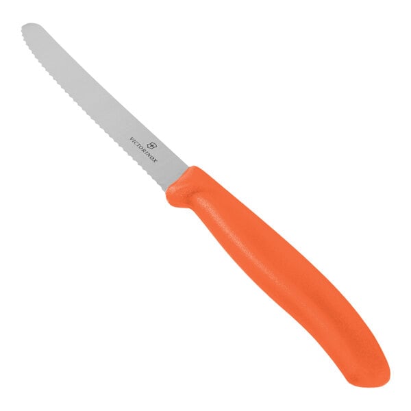 A serrated utility knife with a tangerine orange handle.