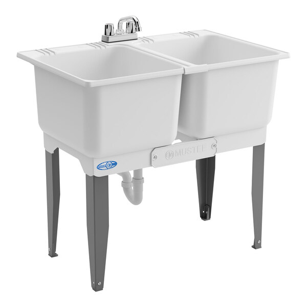 A double-compartment white utility laundry tub sink with steel legs and a faucet kit.