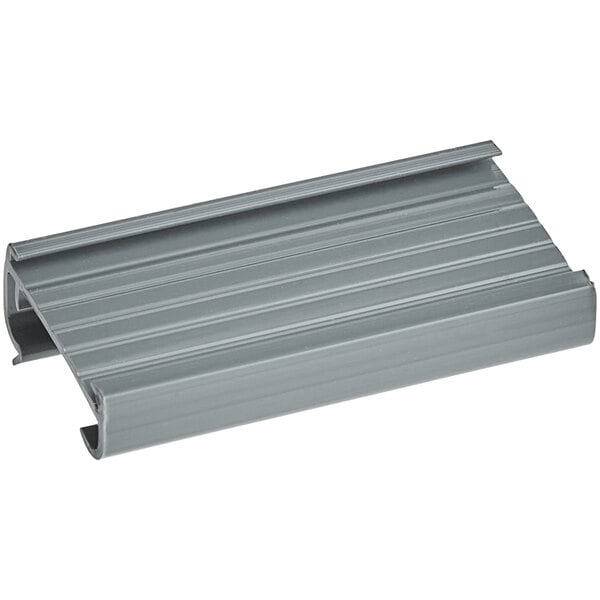 A gray label holder designed for wire shelving, measuring 3 inches by 1 1/4 inches.
