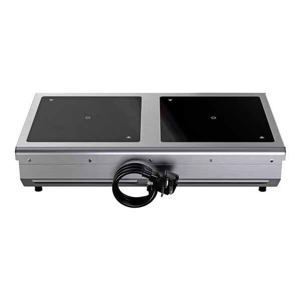 A dual hob side by side countertop induction range with a stainless steel body and a power cord.