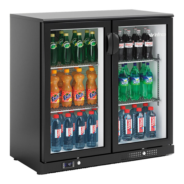 A black narrow glass door back bar refrigerator filled with assorted bottled beverages.