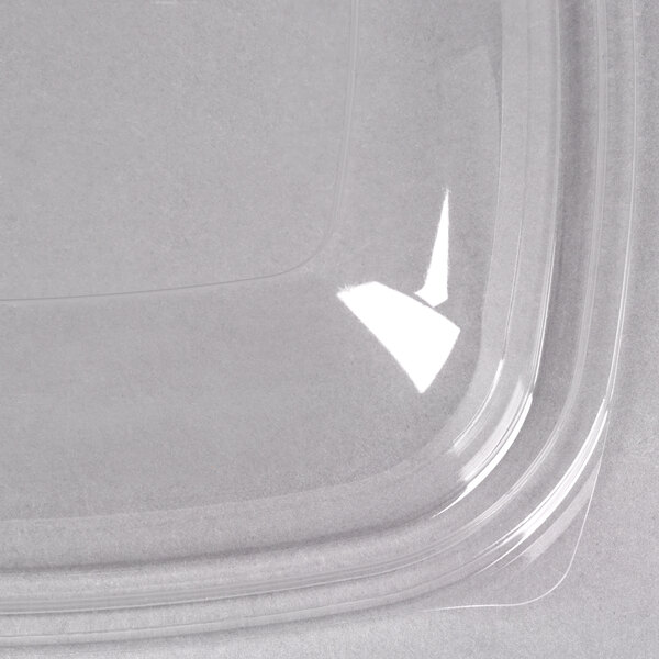 A clear plastic Sabert container with a clear dome lid.