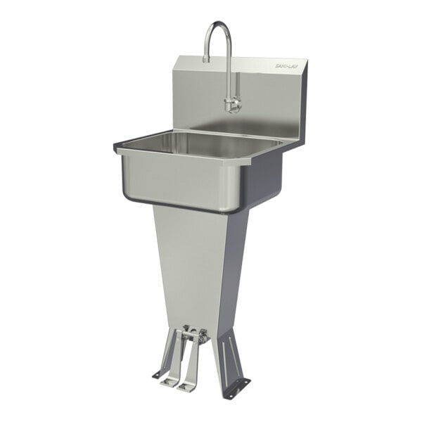 A stainless steel floor-mounted hands-free sink with a double foot-operated faucet.