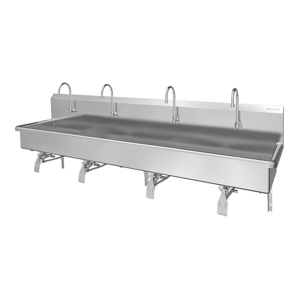 A stainless steel four-person wall-mounted sink with knee pedal hands-free operation.
