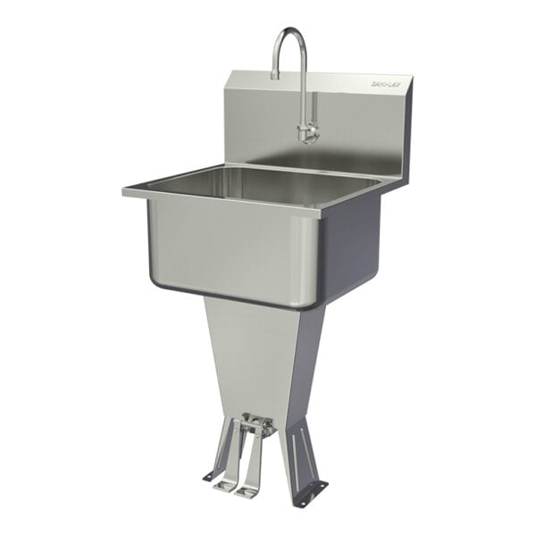 A stainless steel floor-mounted hands-free sink with a double foot-operated faucet.