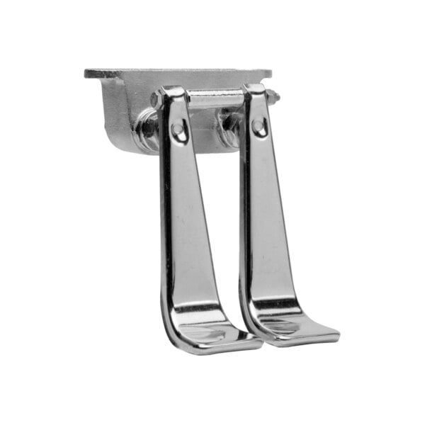 A metal double foot pedal valve with long levers and brass components.