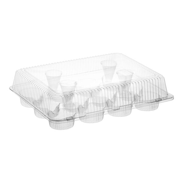 A clear plastic hinged container with a high dome lid and 12 compartments for holding standard cupcakes or muffins.