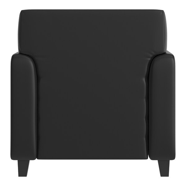 A black leather chair with wooden feet and built-in charging bank.