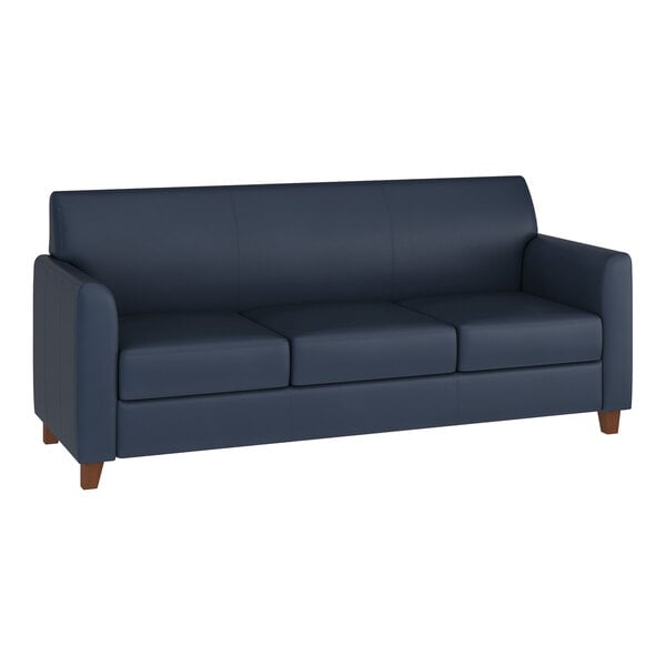 A navy blue three-seat sofa with wooden feet and a modern design.