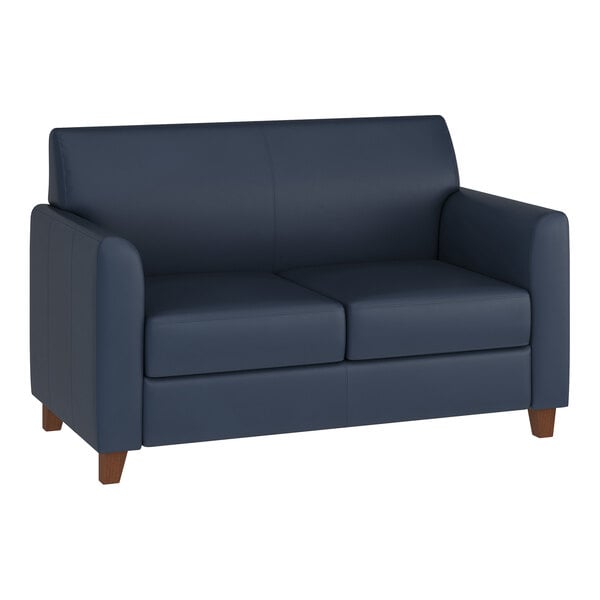 A navy blue loveseat with wooden feet and a modern design.