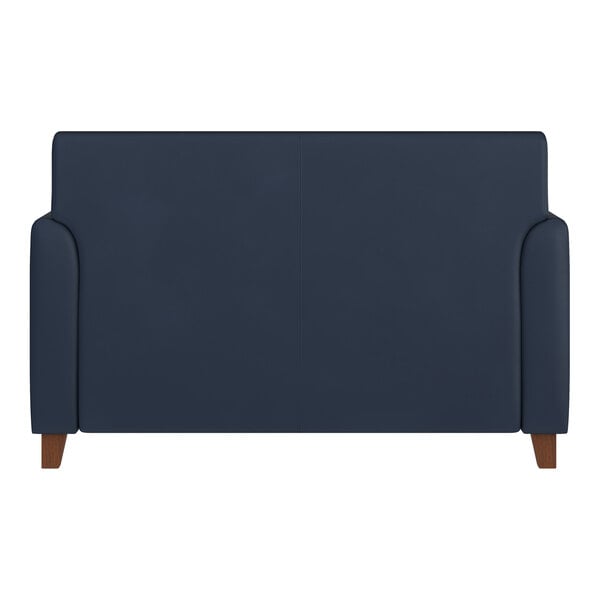 A navy blue loveseat with wooden feet and a smooth backrest.