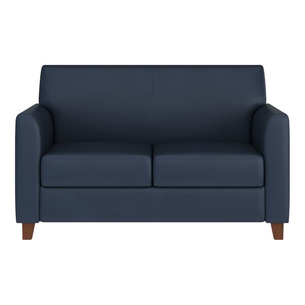 A navy blue loveseat with wooden feet and a modern, boxy design.