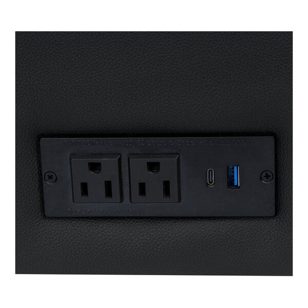 A black charging bank panel with two power outlets, one USB-C port, and one USB-A port, integrated into the side of a chair.