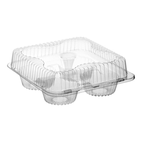 A clear plastic hinged container with four compartments and a medium dome lid for holding jumbo cupcakes or muffins.