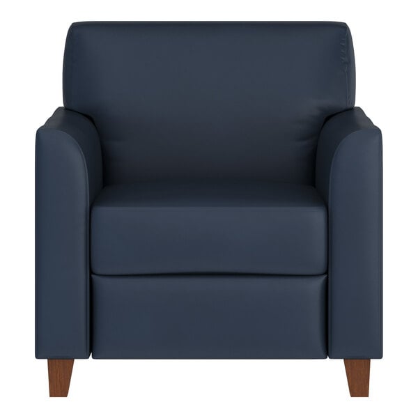 A navy blue leather armchair with wooden legs.