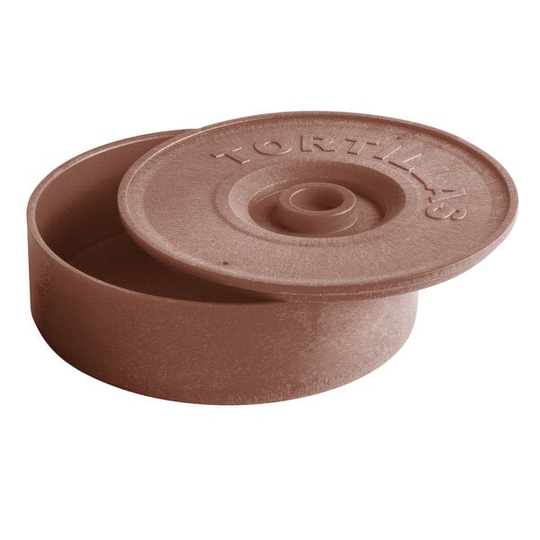 A round brown tortilla warmer with a partially open lid labeled 'TORTILLAS.'