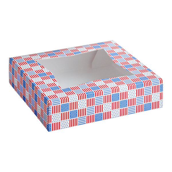 A square bakery box with a clear window on top, decorated with a red, white, and blue patriotic USA print.