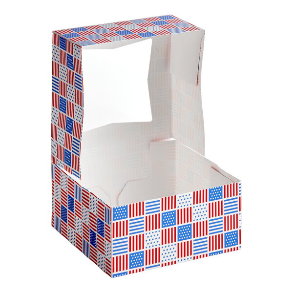 A patriotic USA print bakery box with a clear window and red, white, and blue flag designs.