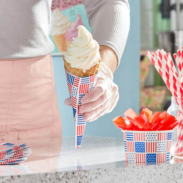A stack of patriotic print 2-ply paper beverage or cocktail napkins with red, white, and blue designs.