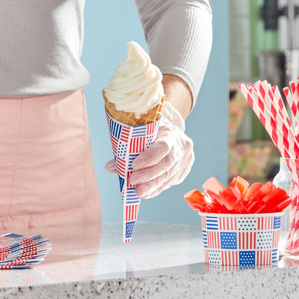 A stack of patriotic print 2-ply paper beverage or cocktail napkins with red, white, and blue designs featuring stars and stripes.