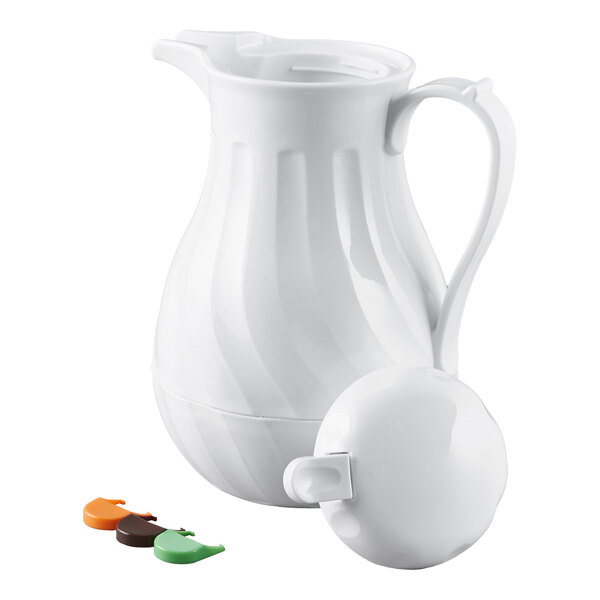 A white thermal swirl coffee carafe with a handle, lid, and three colored tags.