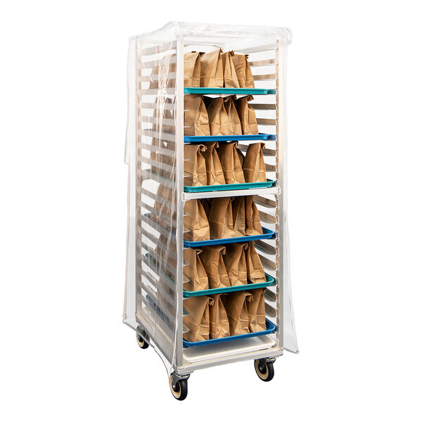 A clear heavy-duty vinyl sheet pan rack cover placed over a rack filled with trays of brown paper bags.