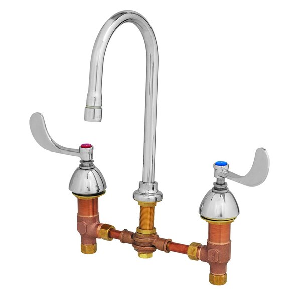 A T&S deck-mount faucet with two brass lever handles.