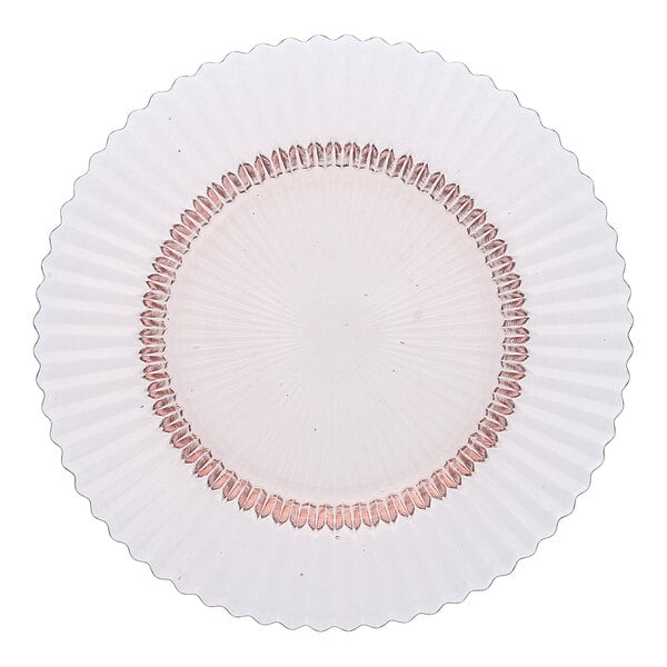 A round pink glass salad plate with a textured design and decorative inner ring.