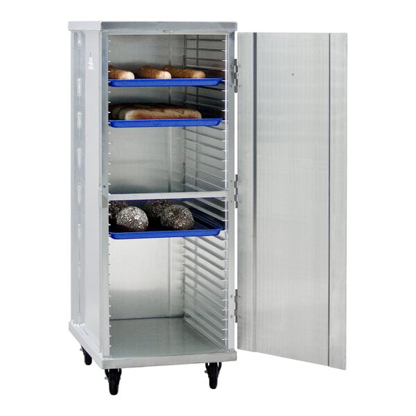 A mobile aluminum enclosed sheet pan rack with multiple shelves, holding several trays of bread.