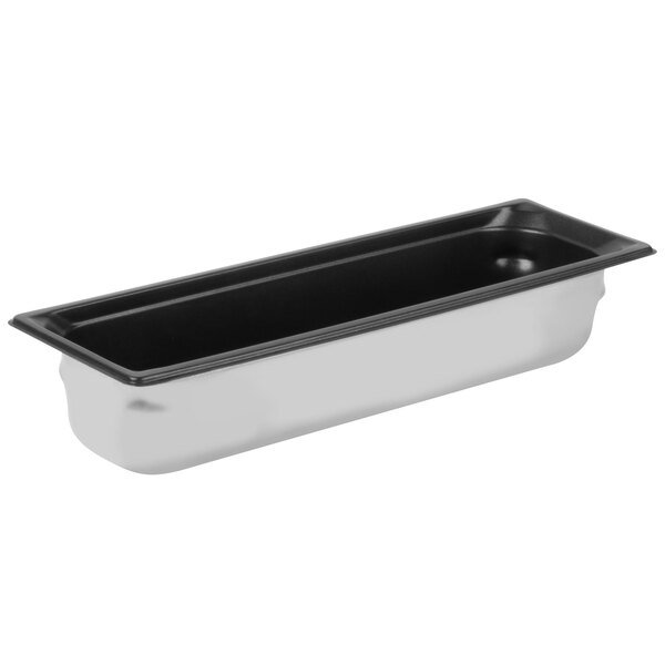 A stainless steel Vollrath Super Pan 3 with a black SteelCoat x3 Non-Stick interior.
