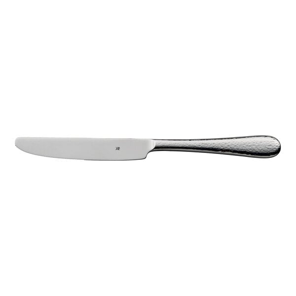 A stainless steel table knife with a textured handle.