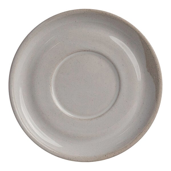 A round white stoneware saucer with a slightly raised center, designed for holding a cup.