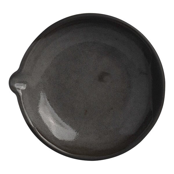 A round gray stoneware spouted sauce dish.