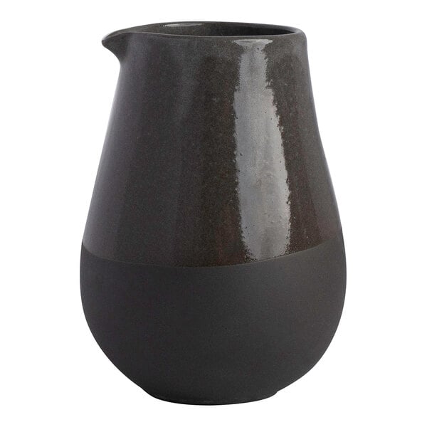 A gray stoneware creamer with a matte and glossy finish, holding 10.25 oz.
