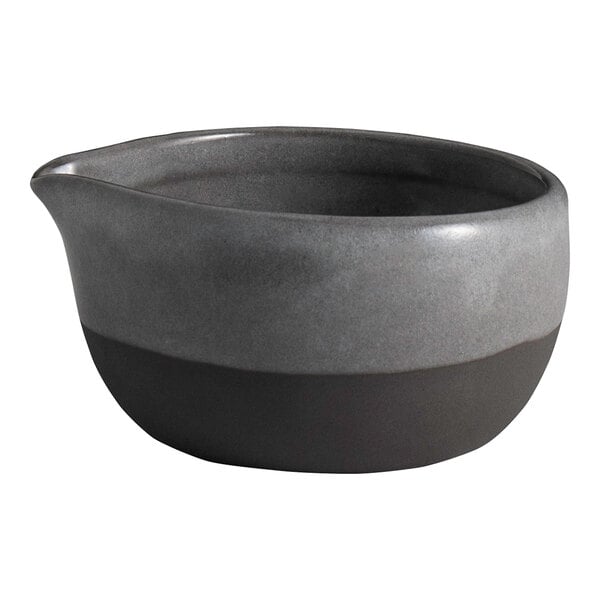 A round gray stoneware spouted ramekin with a matte finish.