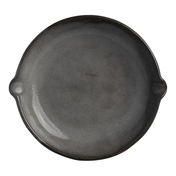 A round gray stoneware bowl with double spouts.