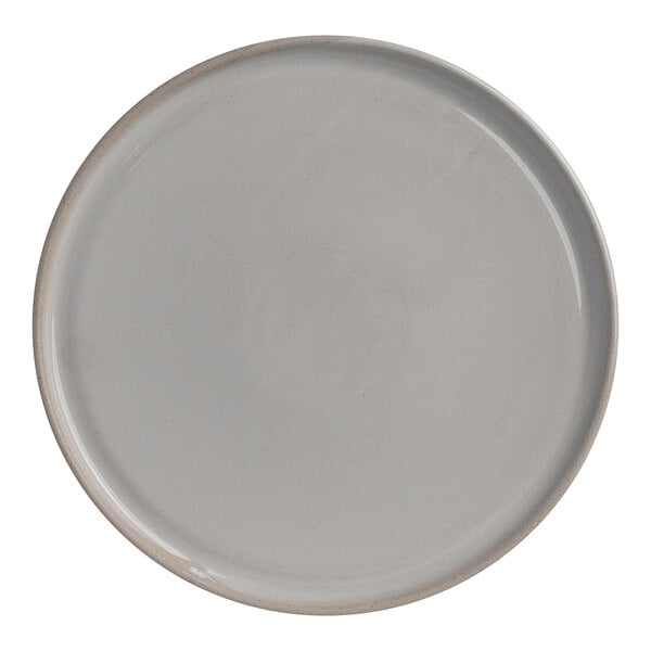 An 11 1/8 inch round white stoneware plate.