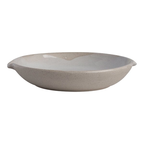 A round white stoneware double-spouted bowl with a 9.5 oz. capacity.
