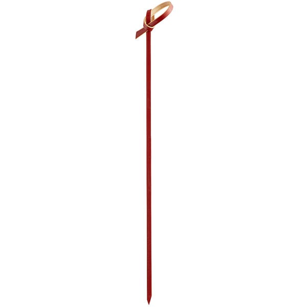 A red bamboo knot food pick or skewer.