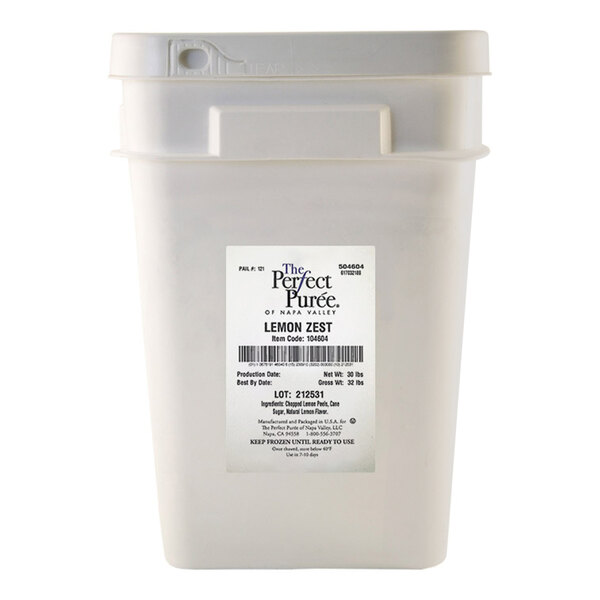 A large plastic container of Perfect Puree Lemon Zest weighing 30 pounds.