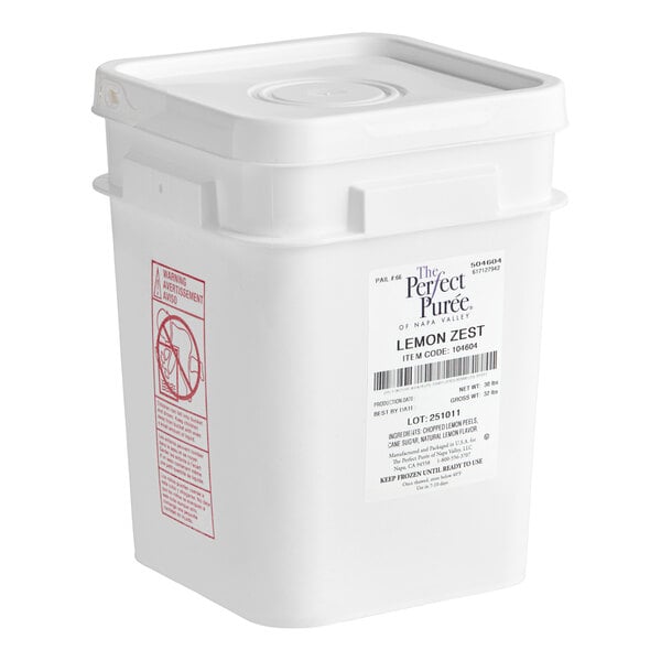 A large white plastic container labeled 'Perfect Puree Lemon Zest' with a 30 lb. capacity.