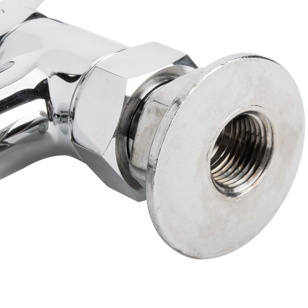 A chrome T&S deck mount faucet with a metal pipe connection.